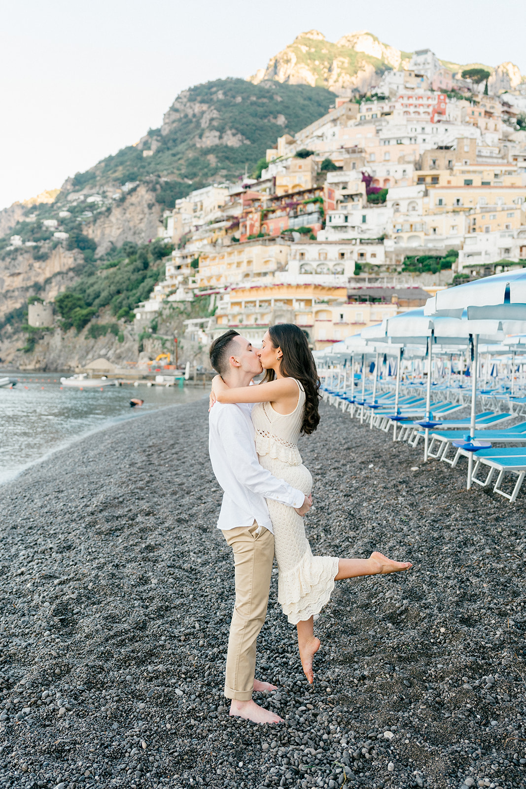 happy couple after surprise engagement in positano beach