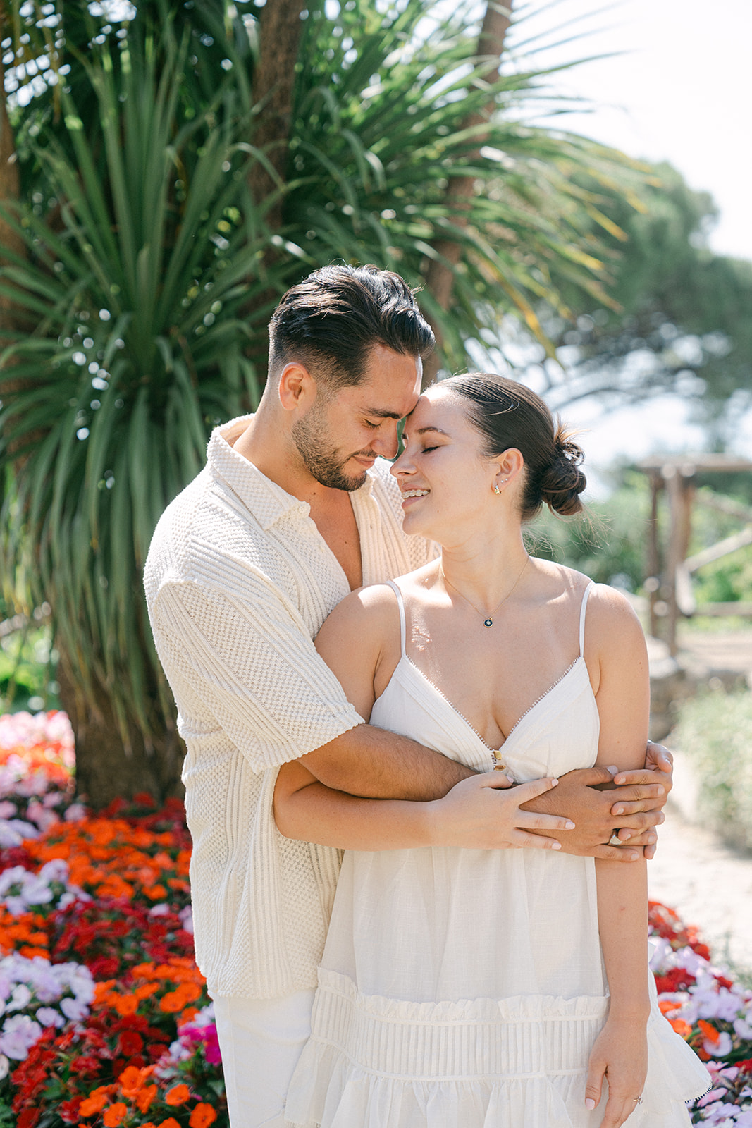Happy couple hugging in a garden in ravello