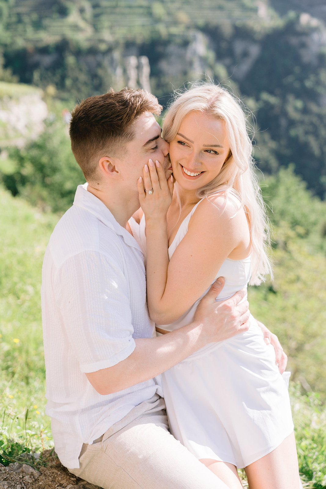 the happy couple kissing outdoor 