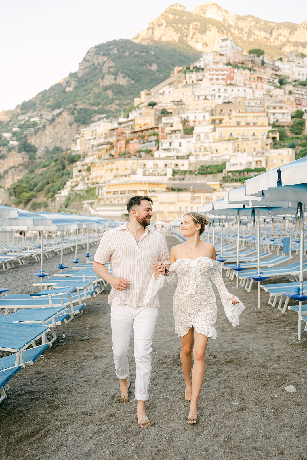 couple running together in Positano