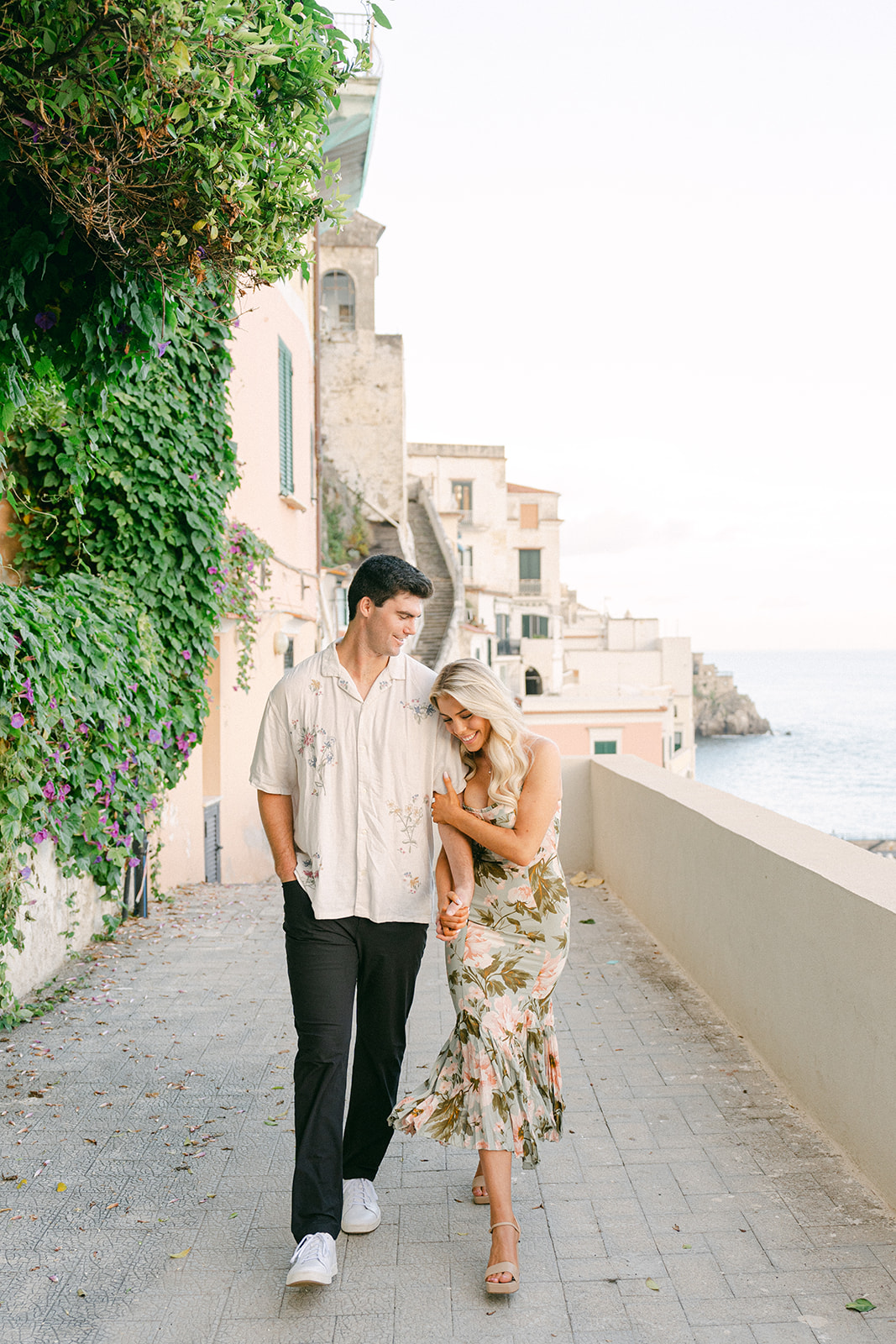couple walking together int hesreets of amalfi coast