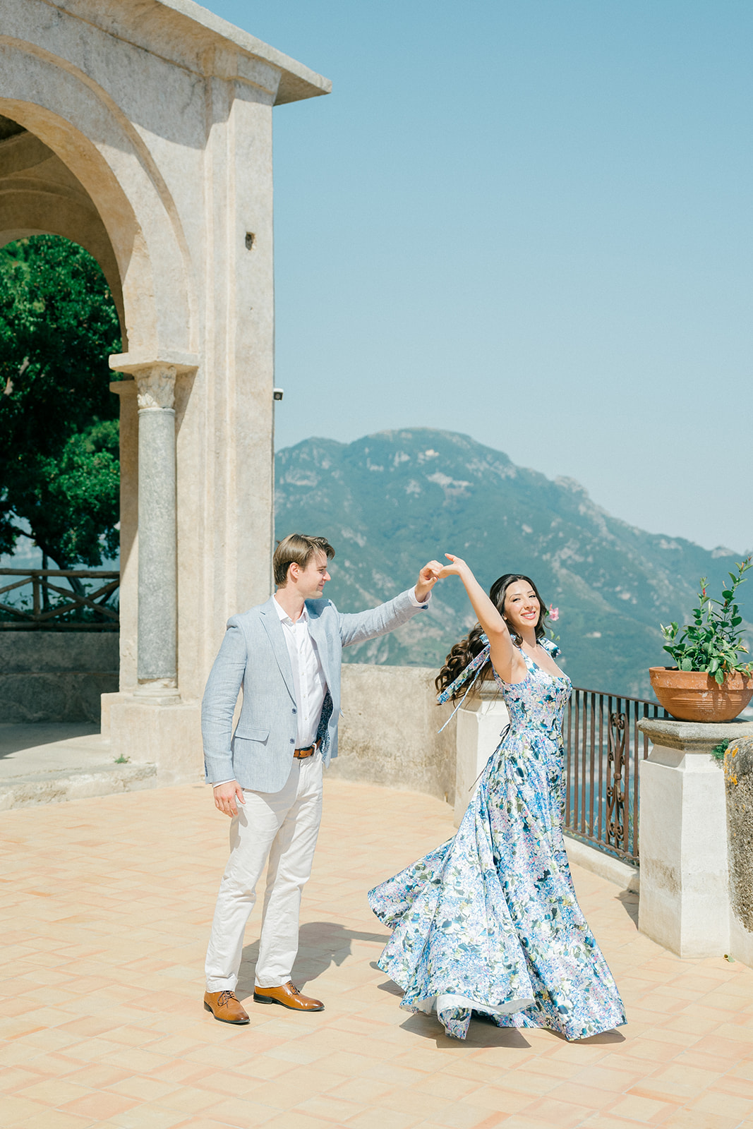 engaged couple dancing outdoor 