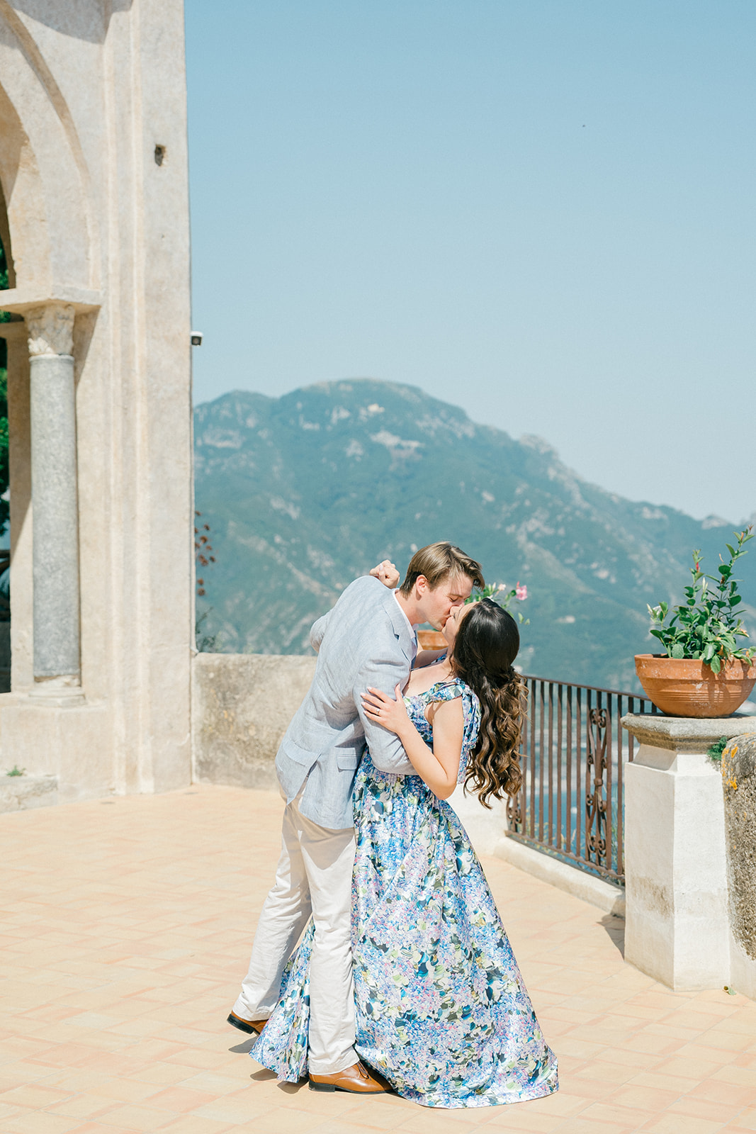 engaged couple dancing and kissing in Amalfi Coast