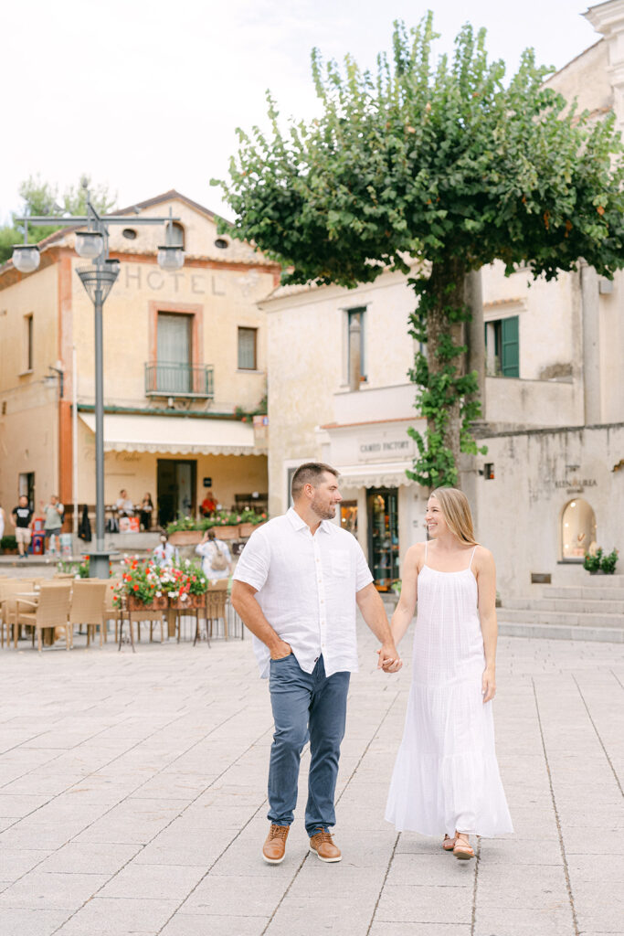 The square of ravello, couple holding hands and exploring the tow