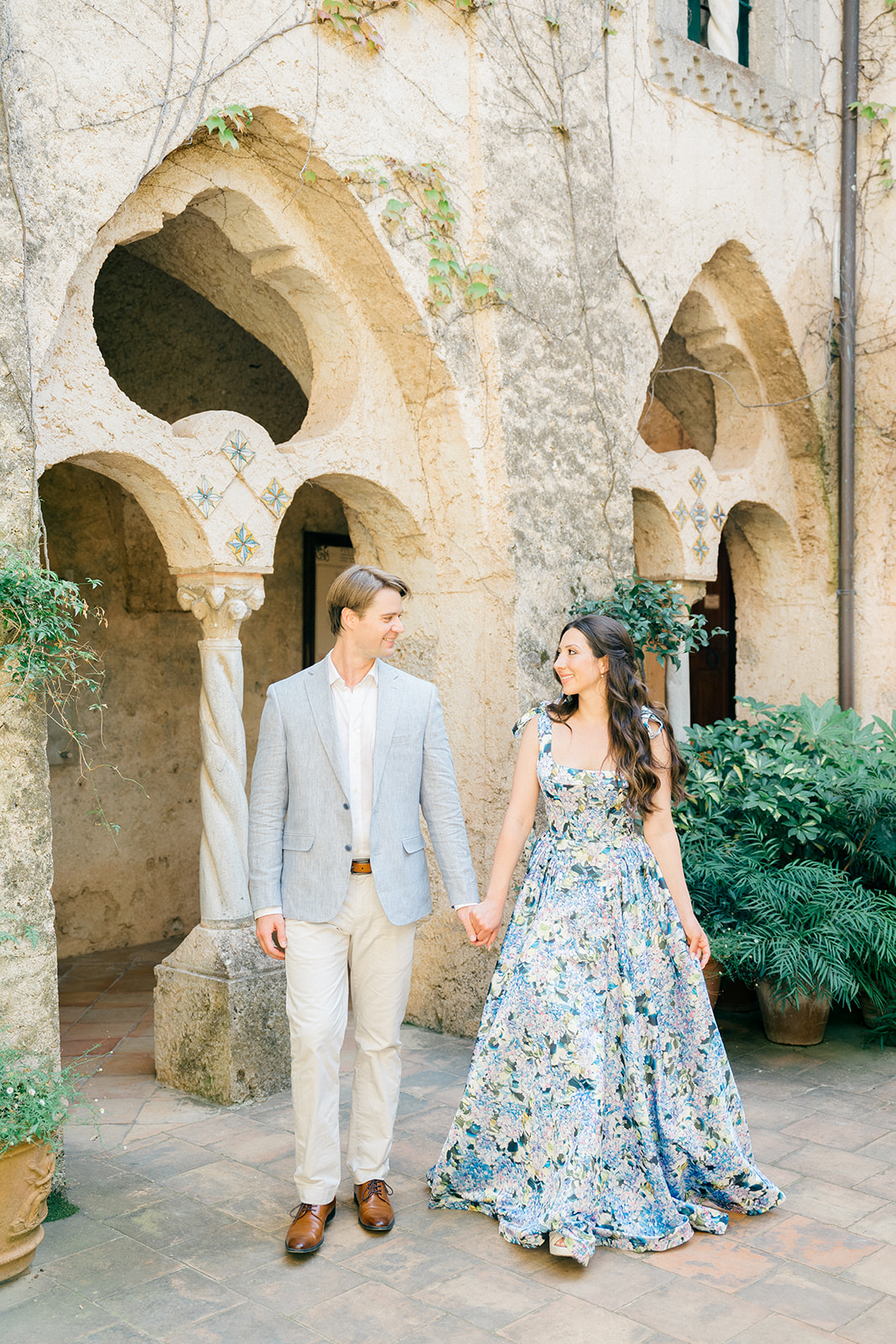 engaged couple holding hands in Villa Cimbrone, Italy