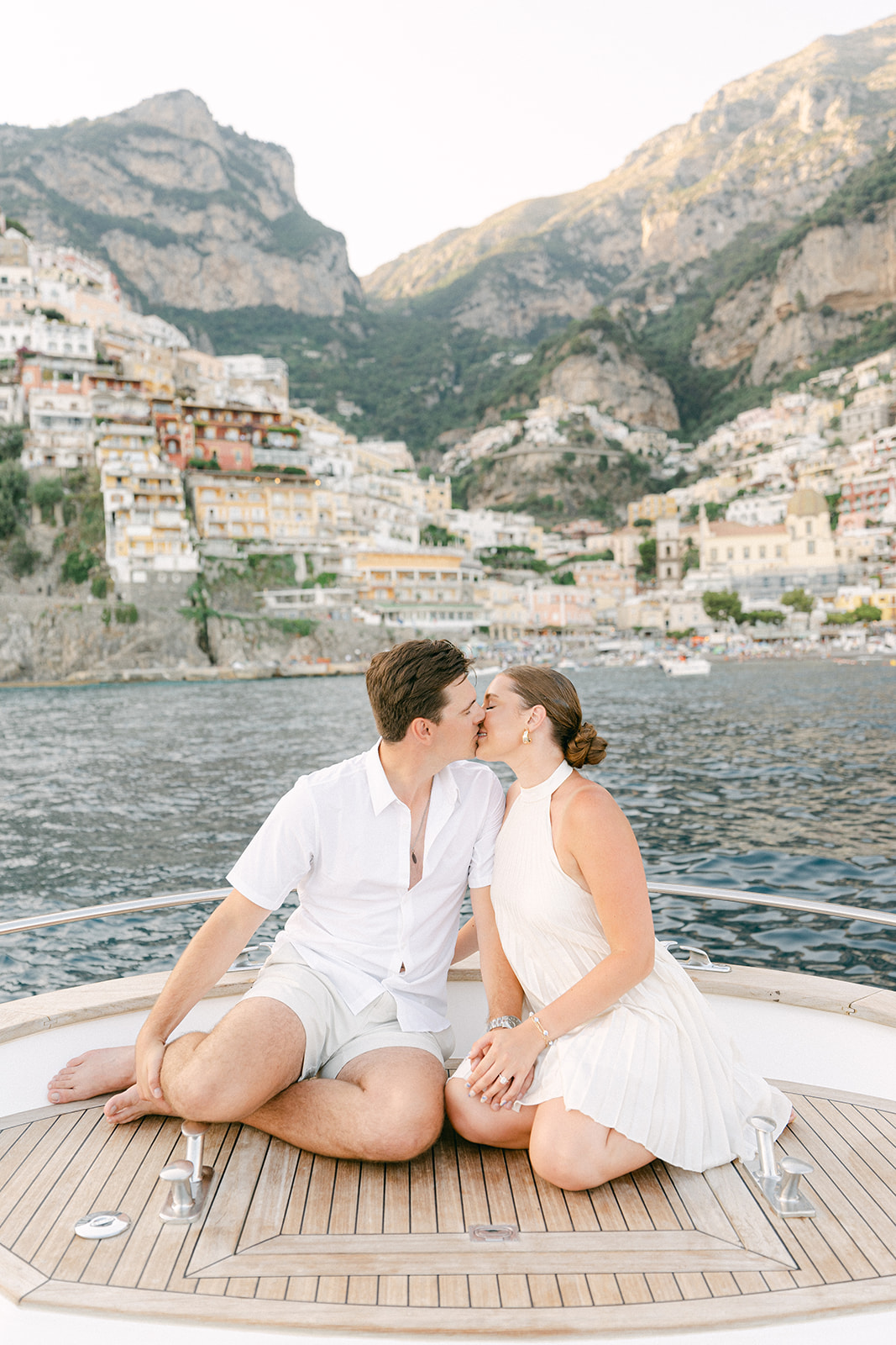romantic couple photo in front of Positano on a boat
