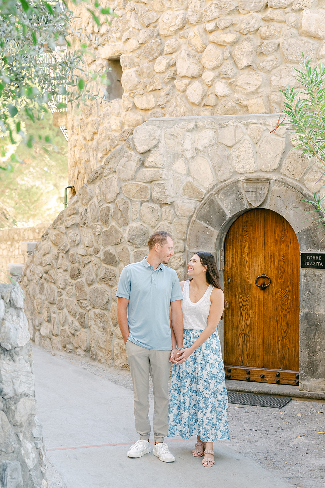 couple wearing causal outfot for summer engagement photoshoot
