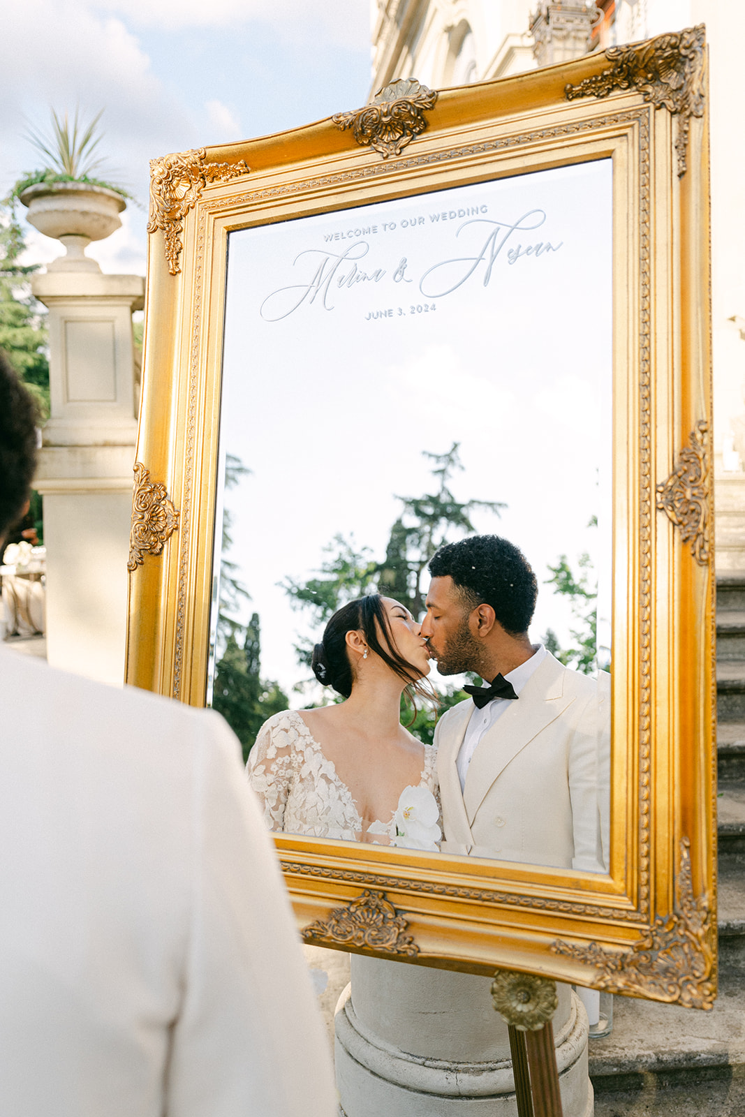 wedding portrait of the bride and groom through a mirror 