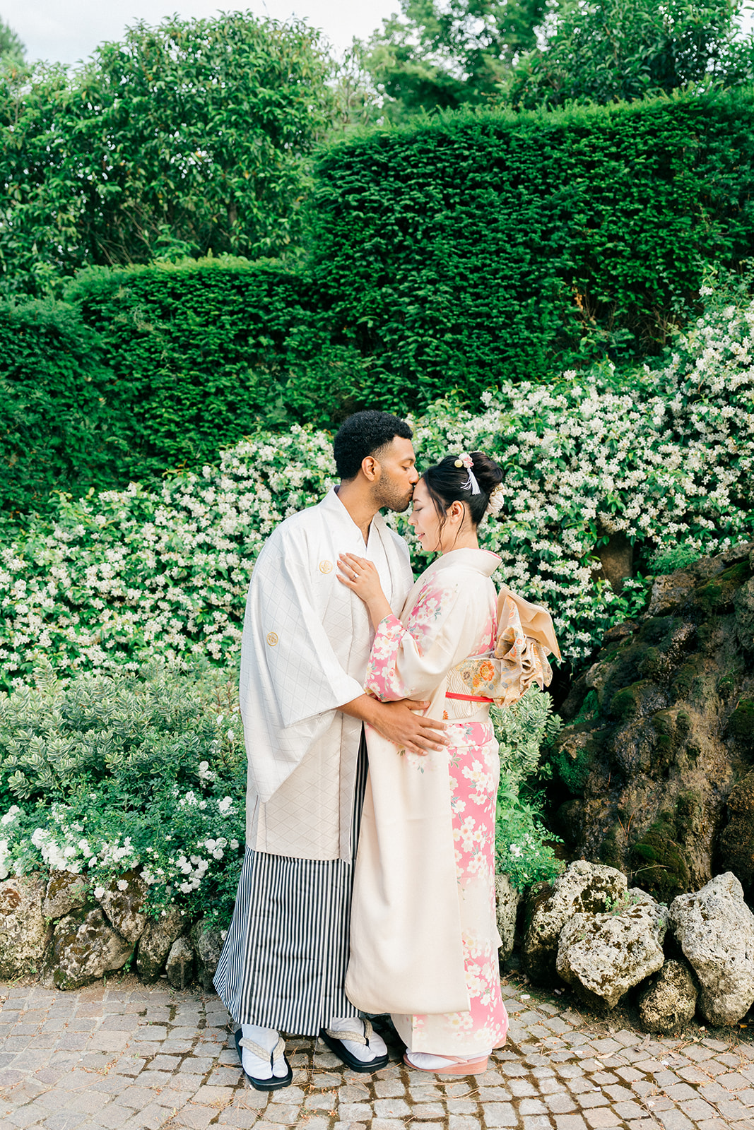 groom kissing the forehead of the bride for a romantic wedding portrait
