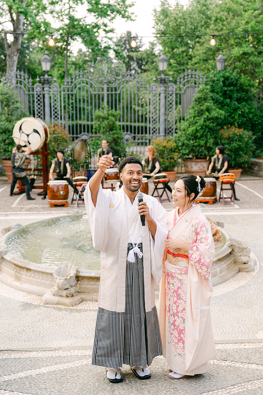 groom giving a toast with his sake during the Japanese wedding ceremony