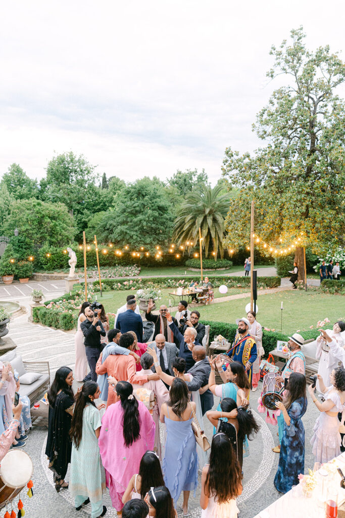 documentary wedding photo during the wedding party as everyone dancing outdoor in Villa Cora