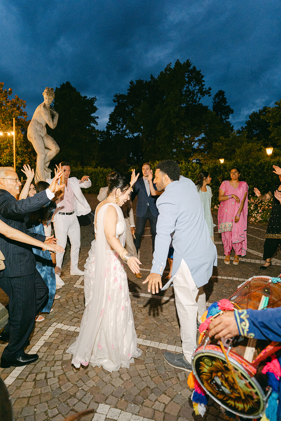 bride and groom dancing during the wedding party with their guests