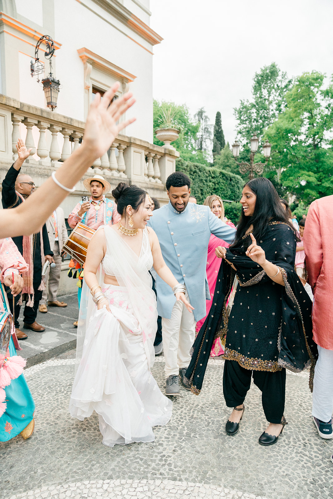 candid wedding photo during an Indian entrance of the wedding celebration