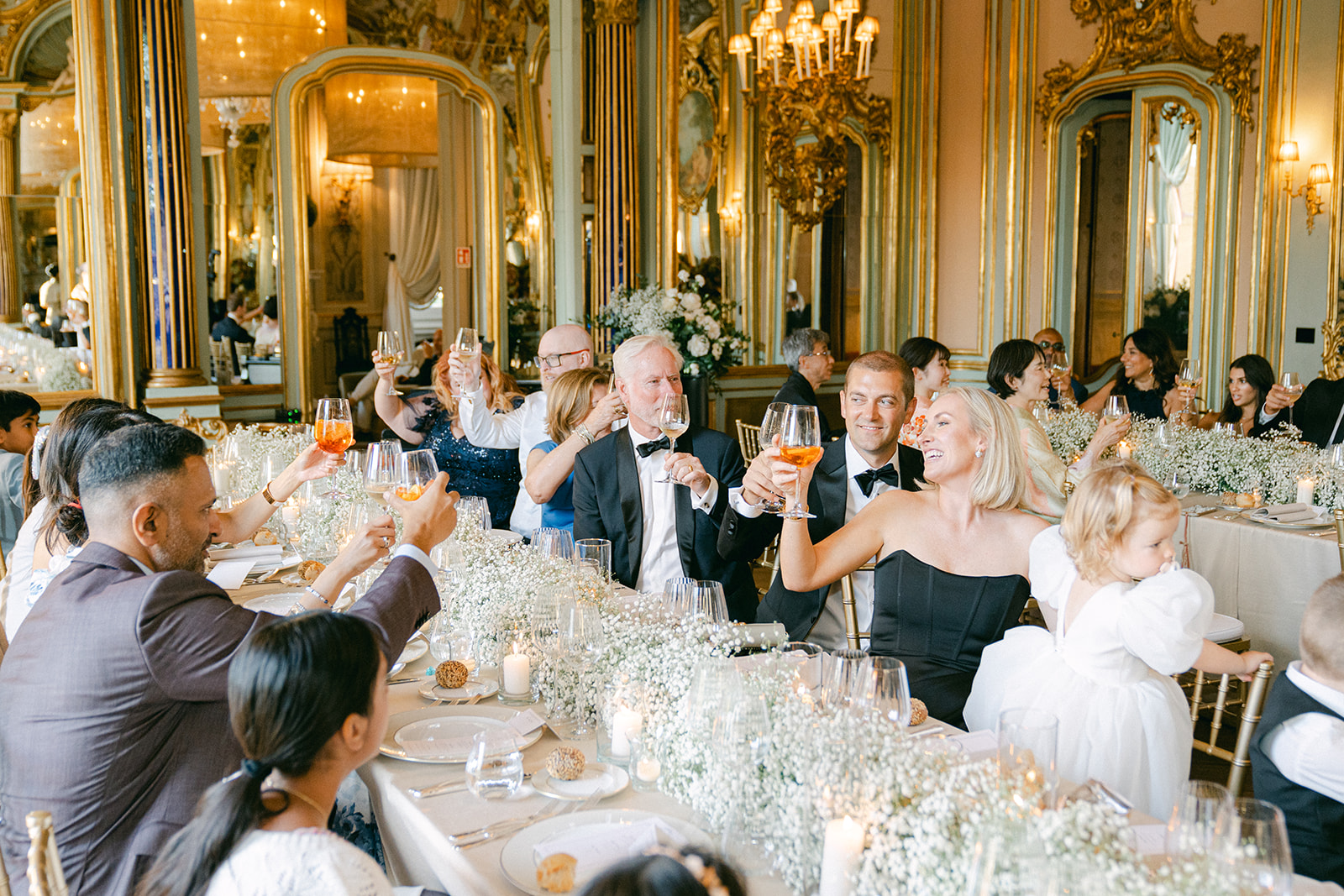 wedding guests toasting during ballroom wedding reception in Villa Cora