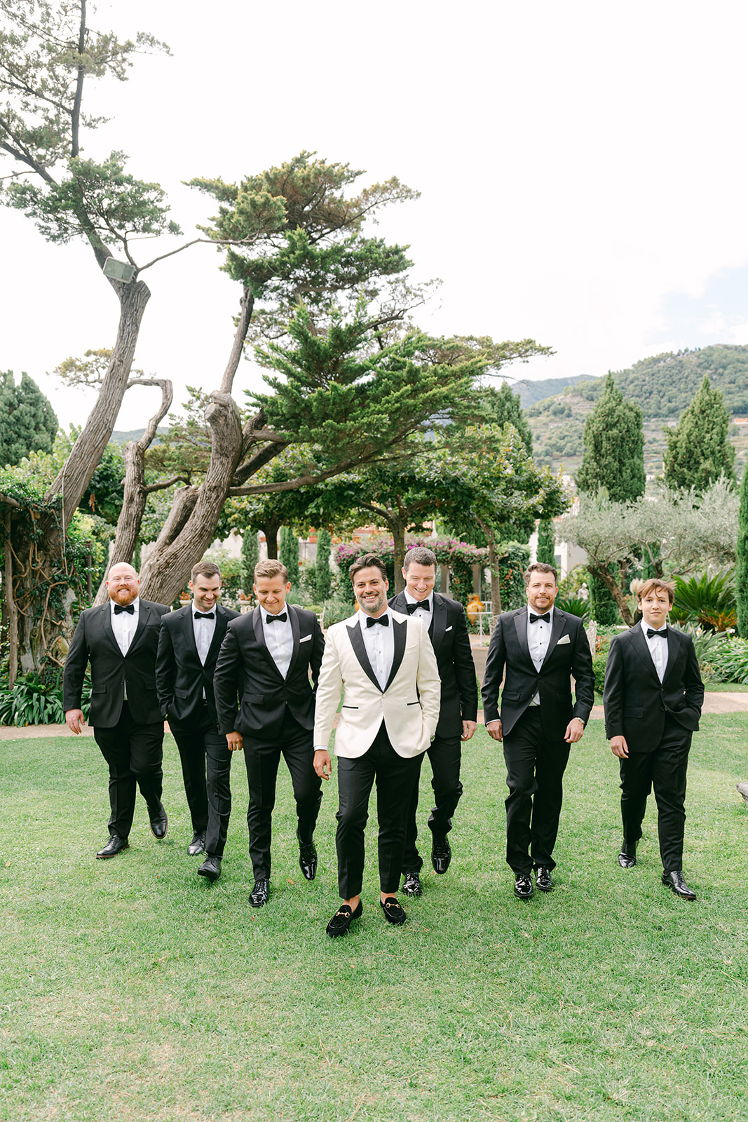 candid wedding photo of the groom and gromsmen