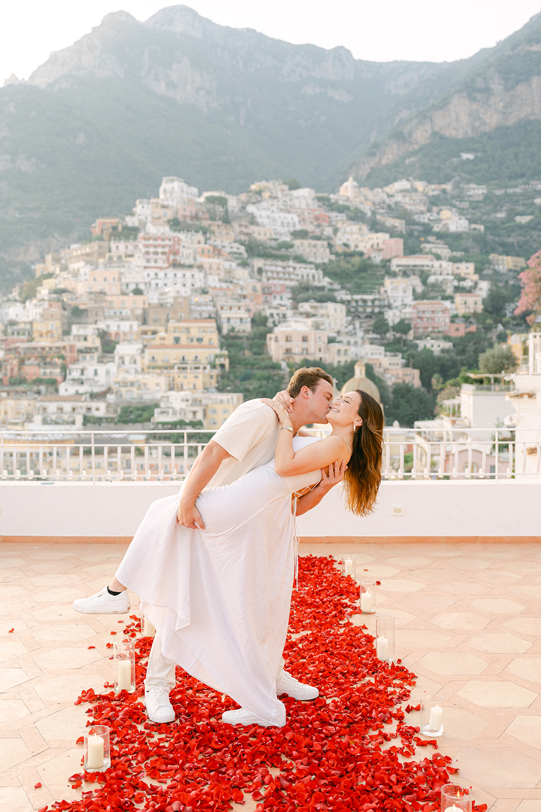 romantic rose petals setup for surprise proposal