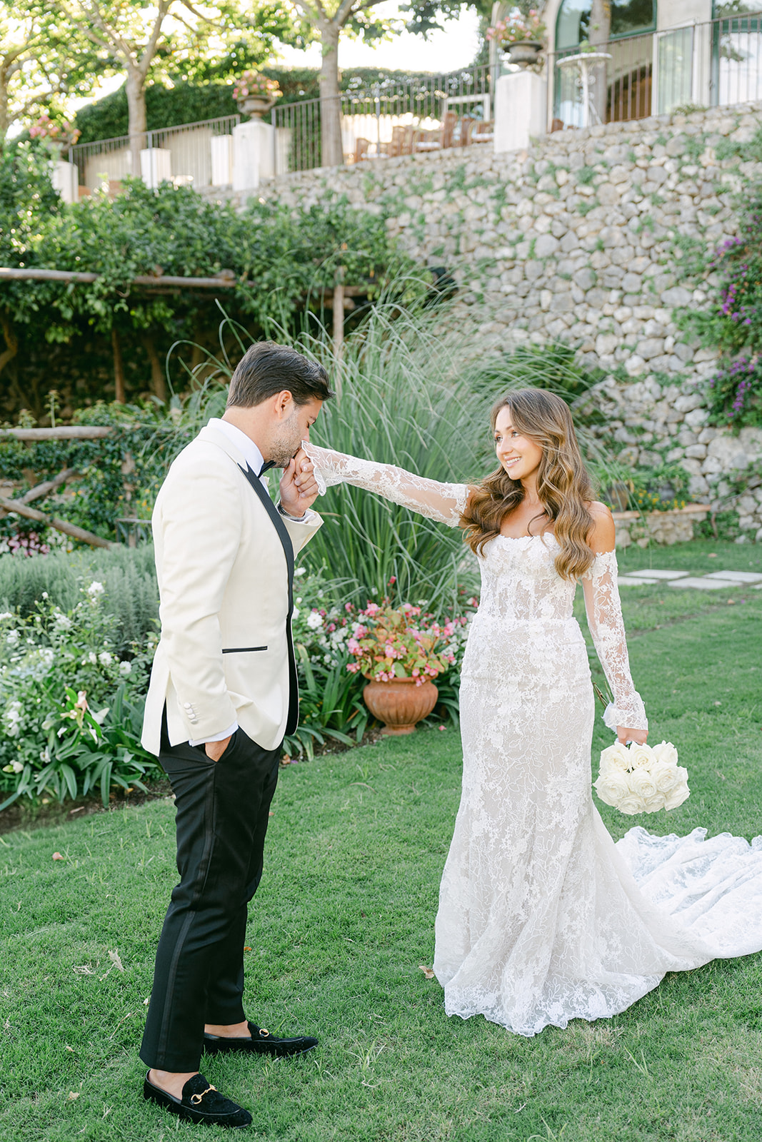 romantic photo of the groom kissing the bride's hand