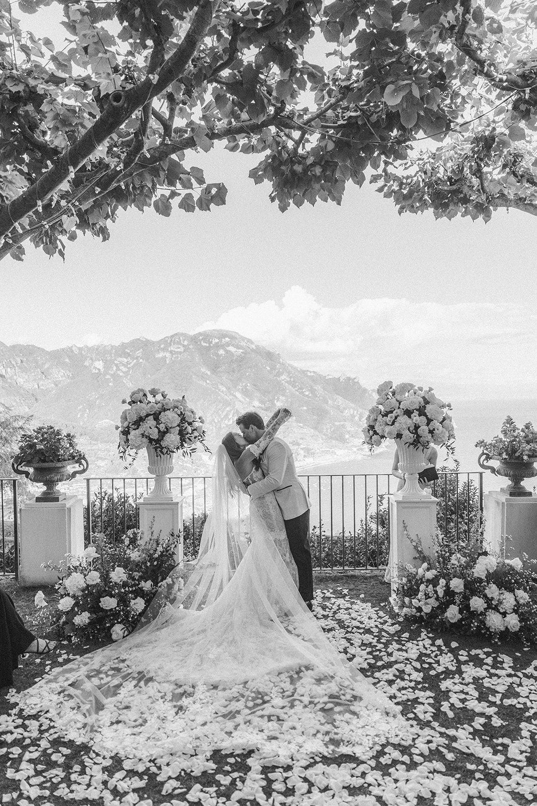 timeless wedding photo of the bride and groom first kiss 