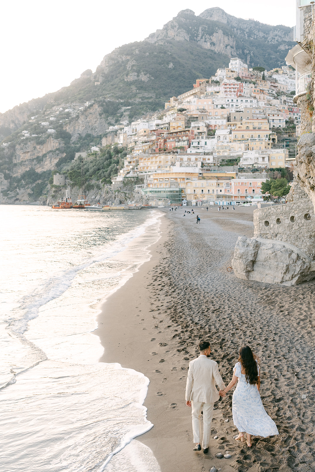 couple walking on the beach for engagement photo