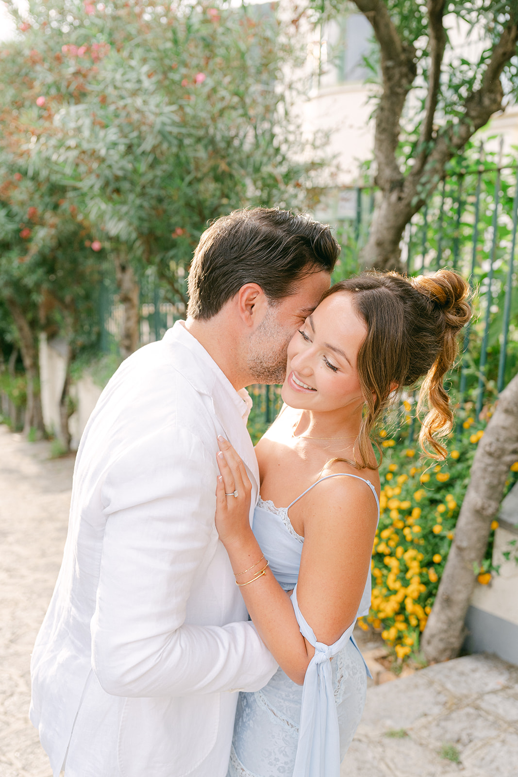romantic portrait of bride and groom hugging