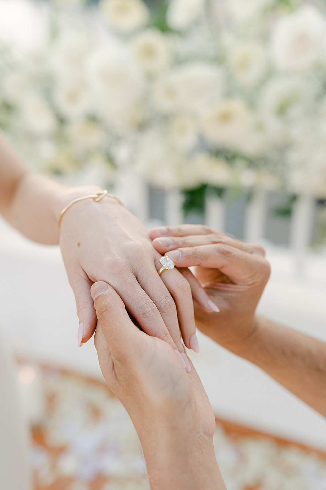 putting the engagement ring on to the future bride