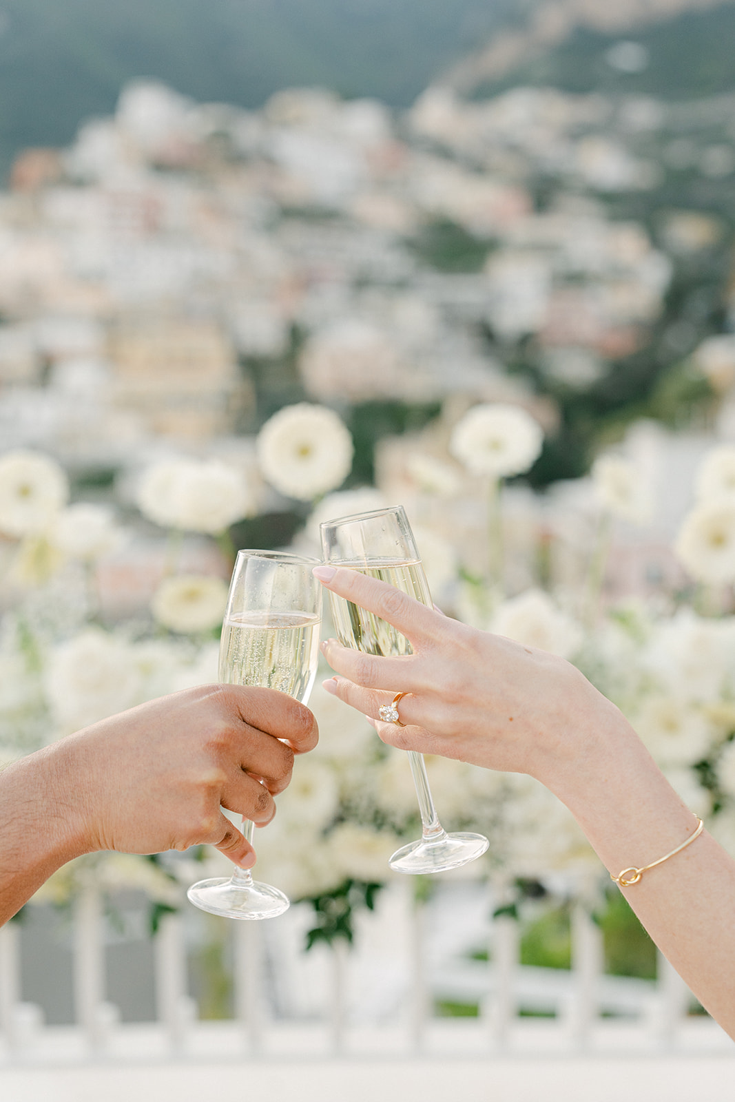 romantic surprise engagement photo of couple toasting