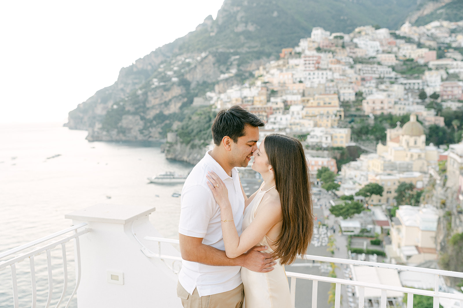 couple kissing for romantic engagement photo