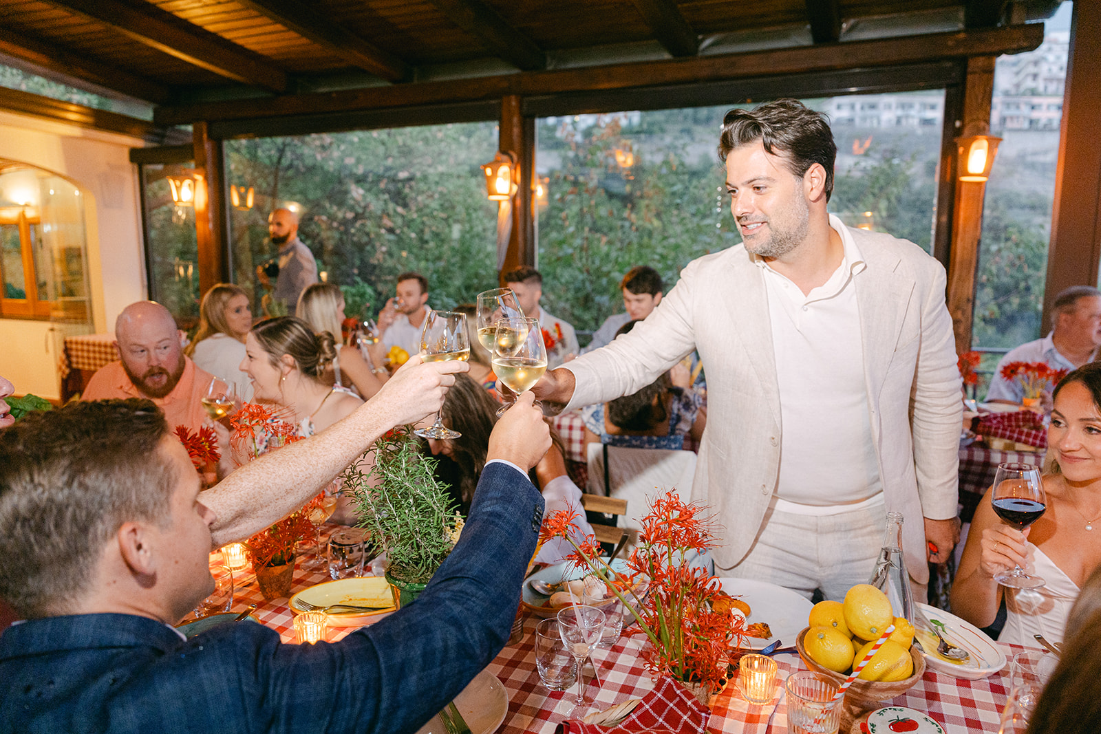 groom toasting with the guests for rehearsal dinner 