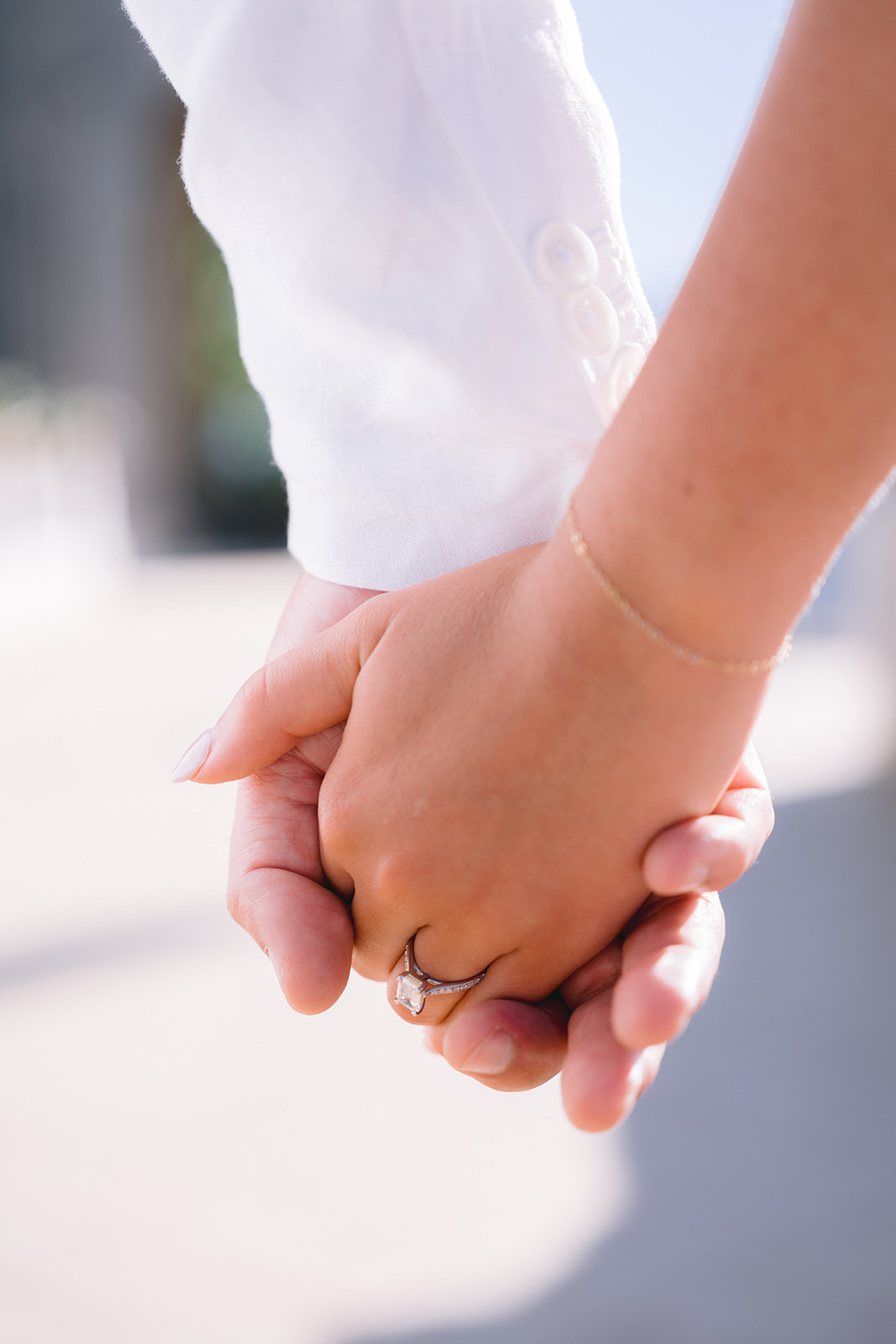 engagement photo of the couple holding hands