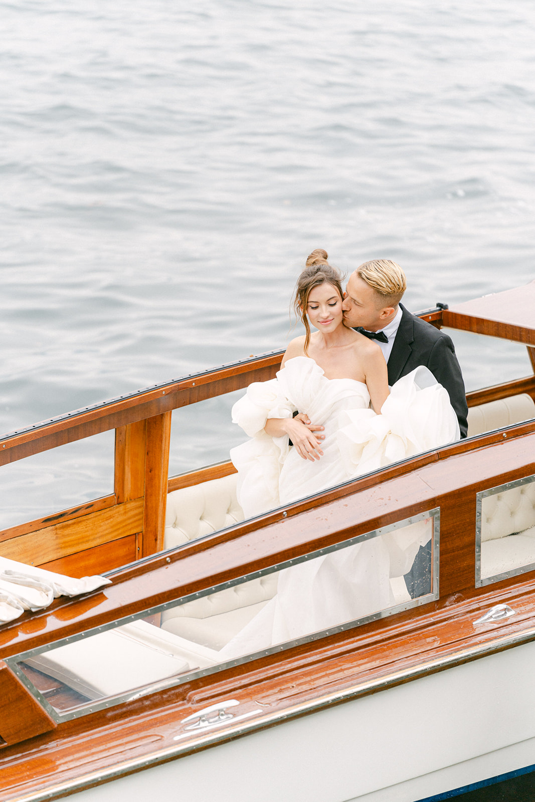 boat wedding photos of bride and groom in lake Como