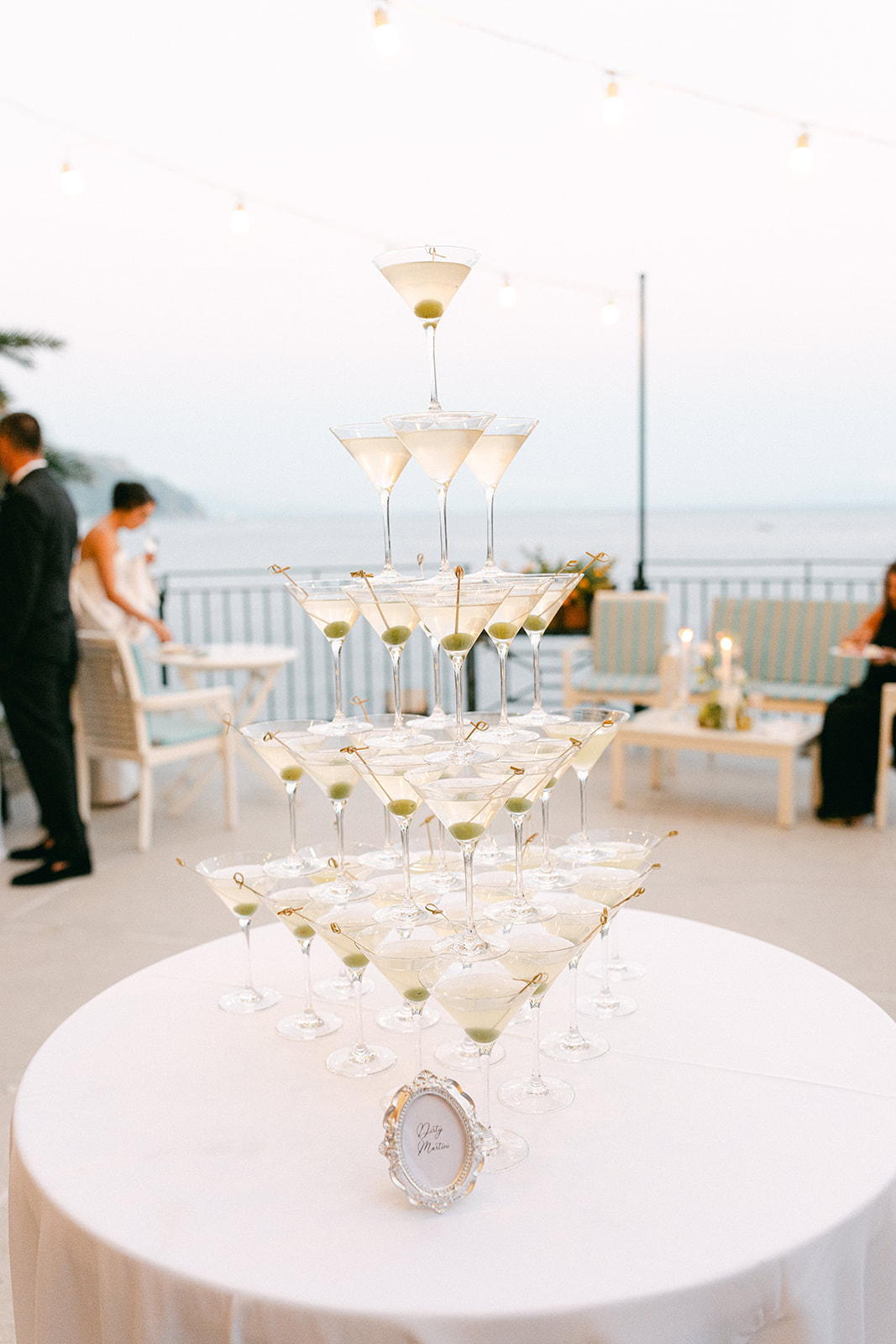 Andrea Gallucci - Destination Wedding Photographer- Amalfi Coast Positano Santorini Barcellona Rome Ravello Paris New York Luxury wedding celebration with an elevated dirty martini tower.