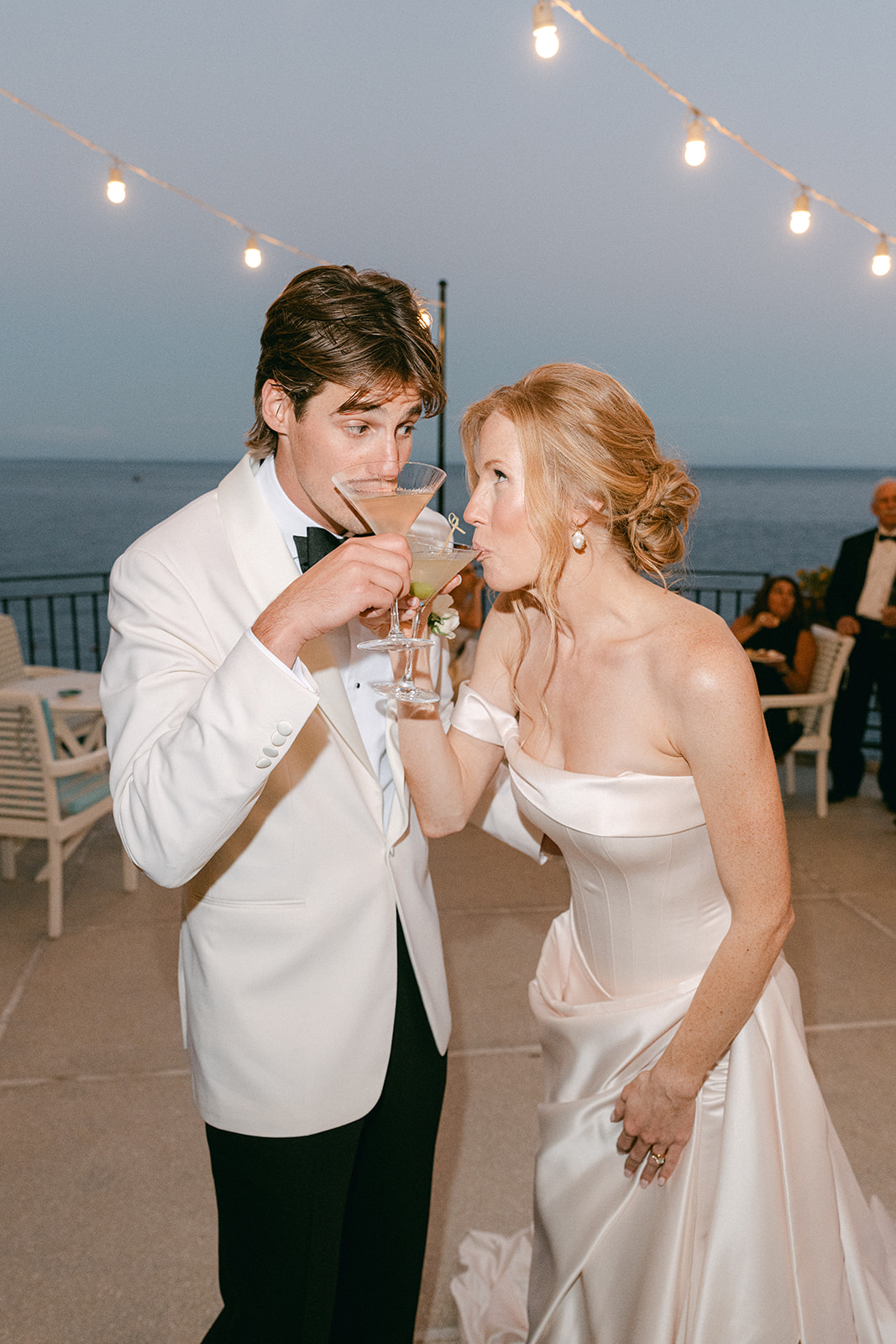 Andrea Gallucci - Destination Wedding Photographer- Amalfi Coast Positano Santorini Barcellona Rome Ravello Paris New York Bride and groom cheers at a martini tower during Amalfi Coast wedding.