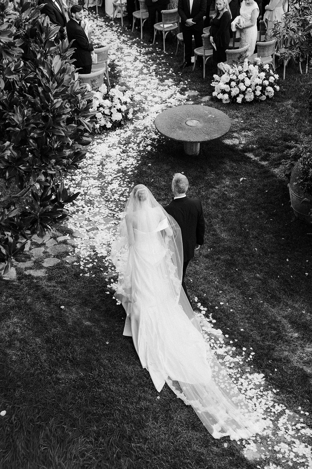 Andrea Gallucci - Destination Wedding Photographer- Amalfi Coast Positano Santorini Barcellona Rome Ravello Paris New York Bride walking down the aisle at a luxury coastal wedding in Italy.