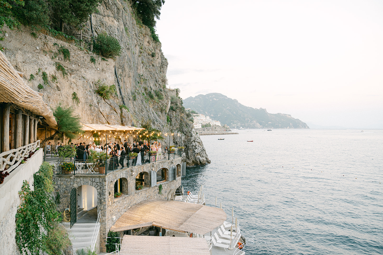 Andrea Gallucci - Destination Wedding Photographer- Amalfi Coast Positano Santorini Barcellona Rome Ravello Paris New York Lush floral canopy and candlelit tablescape at Italian wedding