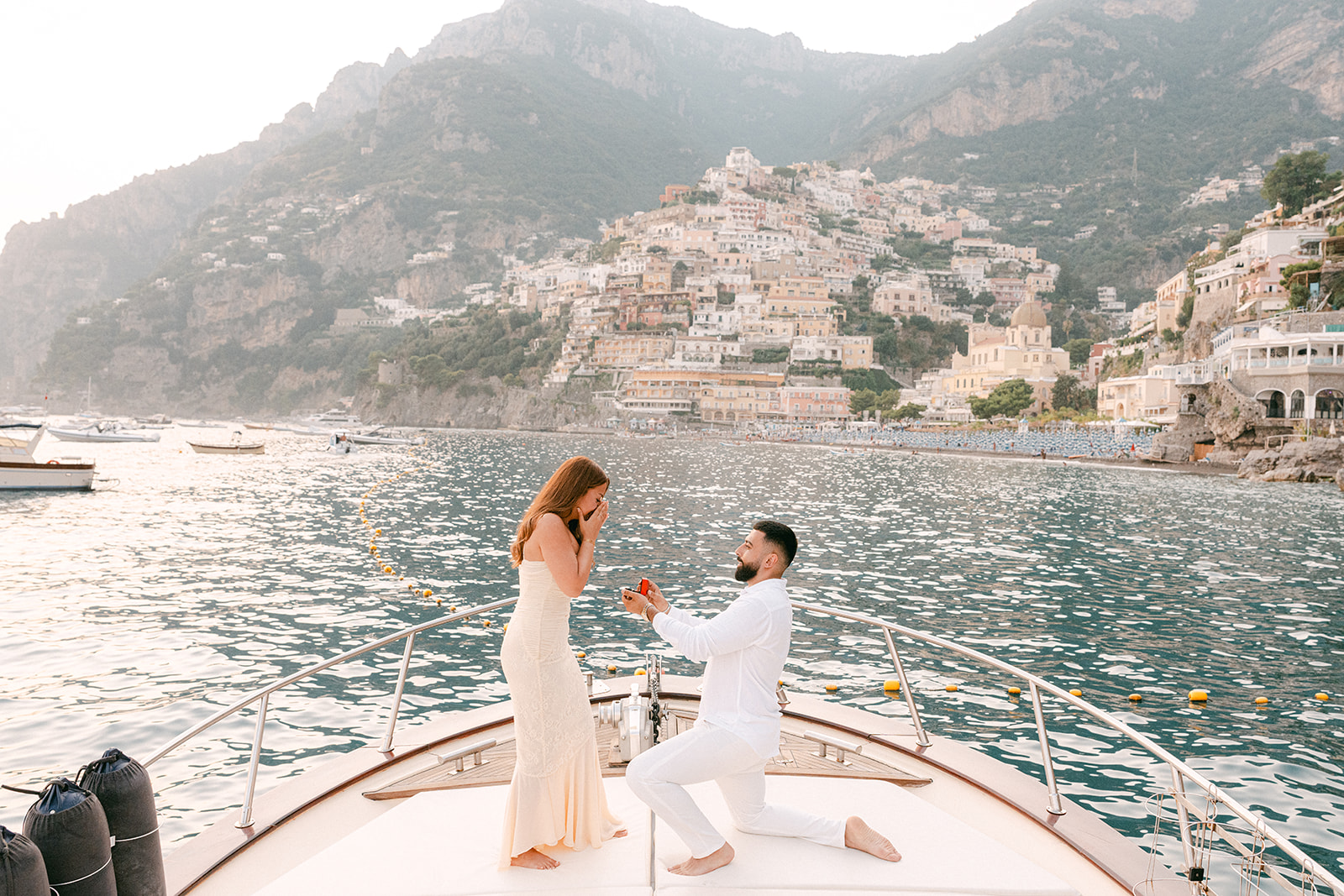 Partner kneeling during intimate Amalfi Coast proposal