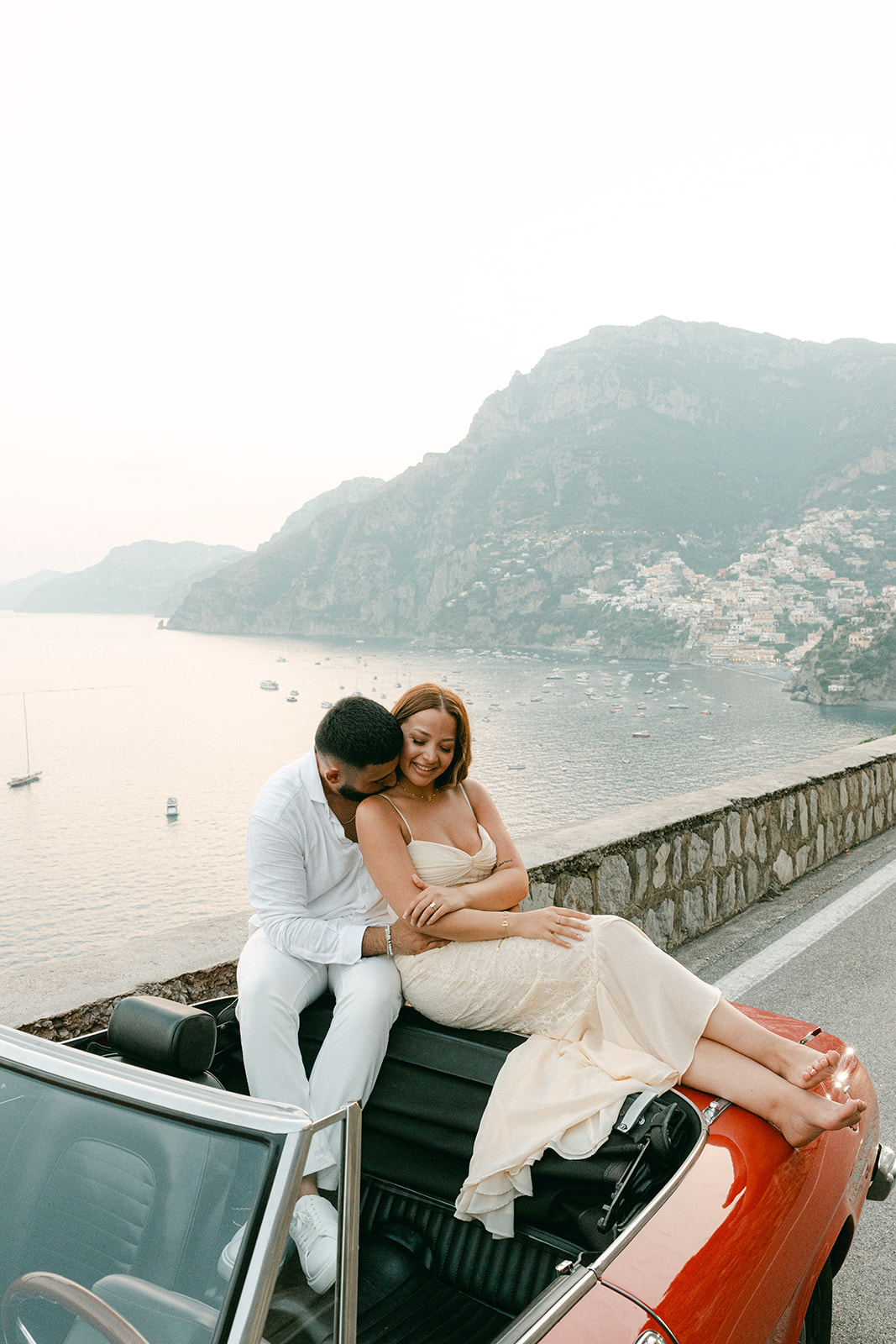 Authentic engagement photos on the Amalfi Coast on a vintage car