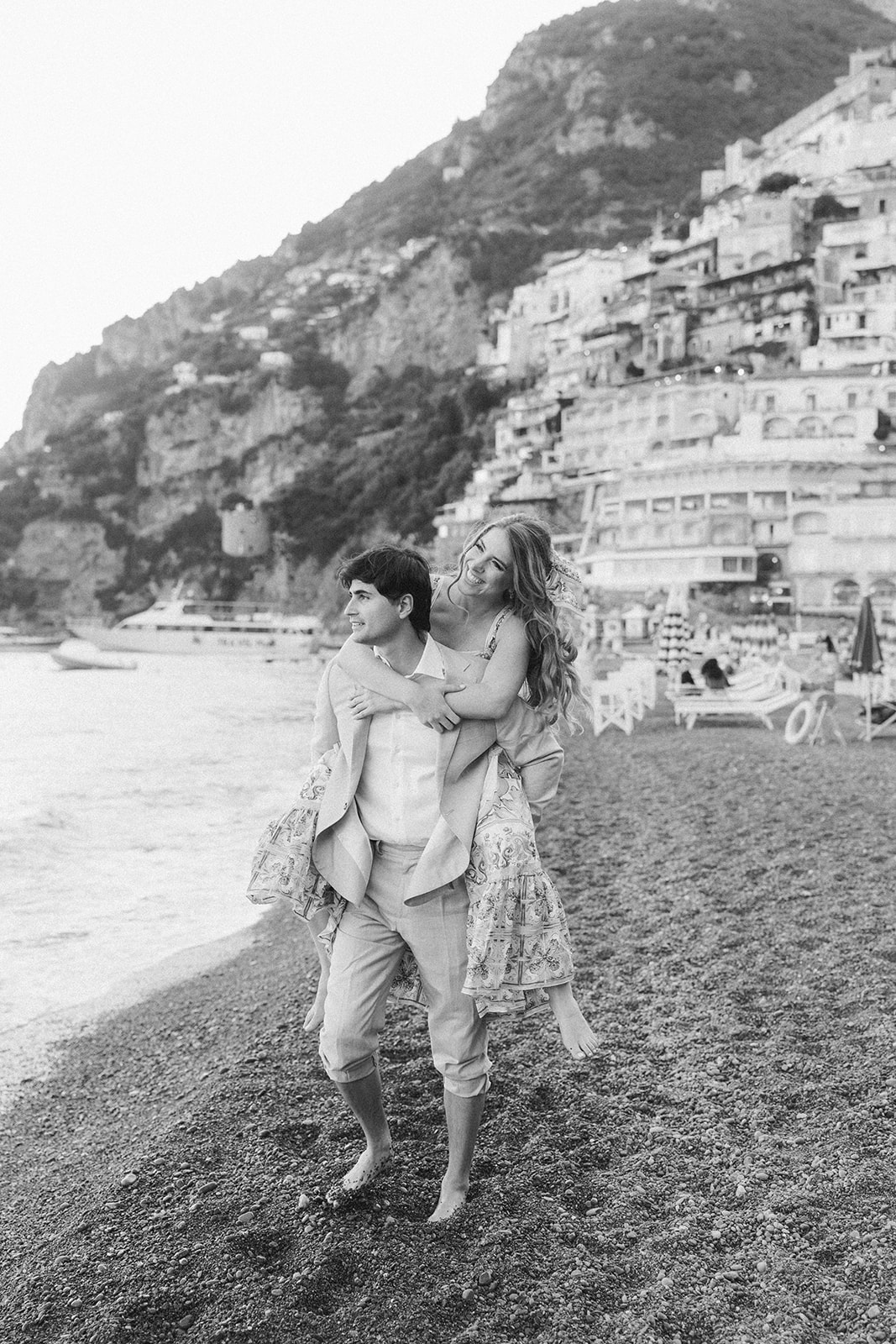 Andrea Gallucci - Destination Wedding Photographer- Amalfi Coast Positano Santorini Barcellona Rome Ravello Paris New York Couple exploring Positano beach during an Amalfi Coast vacation photoshoot