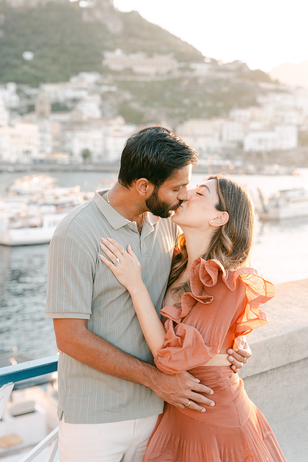 Andrea Gallucci - Destination Wedding Photographer- Amalfi Coast Positano Santorini Barcellona Rome Ravello Paris New York Couple embracing with sea views during an Amalfi Coast vacation photoshoot