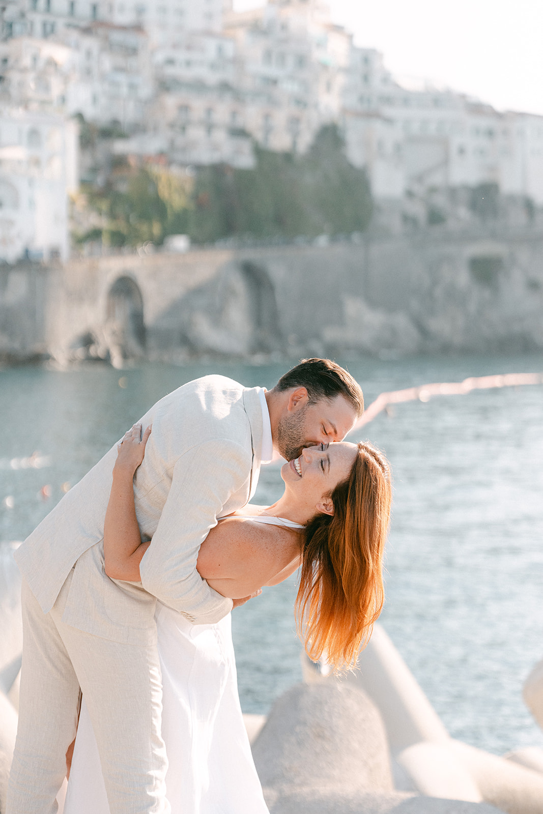 Andrea Gallucci - Destination Wedding Photographer- Amalfi Coast Positano Santorini Barcellona Rome Ravello Paris New York Couple enjoying sunset views over the Amalfi Coast during engagement photos