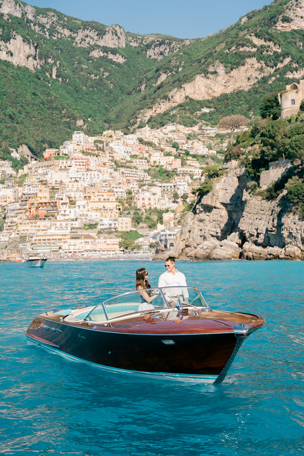 Andrea Gallucci - Destination Wedding Photographer- Amalfi Coast Positano Santorini Barcellona Rome Ravello Paris New York Amalfi Coast boat engagement photos with dramatic coastal cliffs in the background