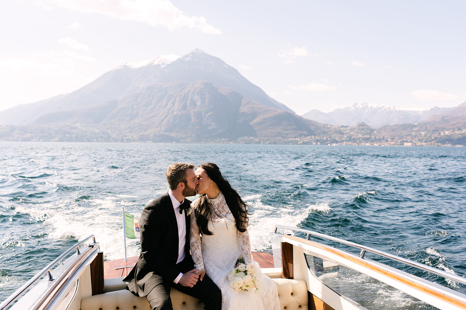 Couple enjoying boat ride during Lake Como elopement experience
