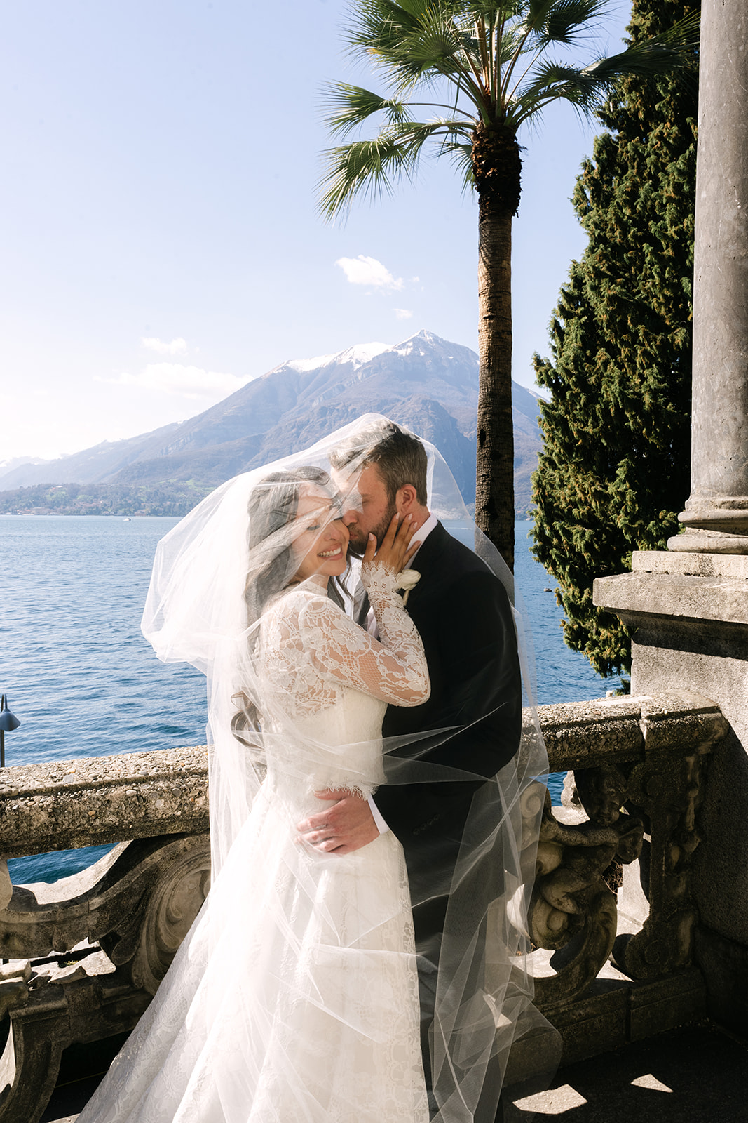 Lake Como elopement detail of couple embracing near the water