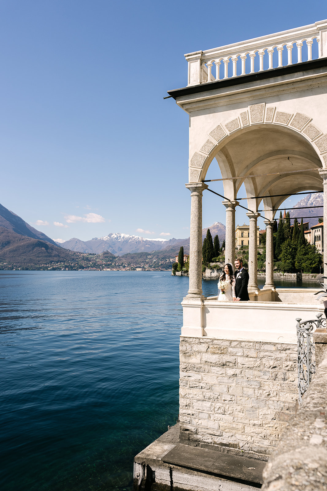 Lake Como elopement couple with panoramic lake and mountain views
