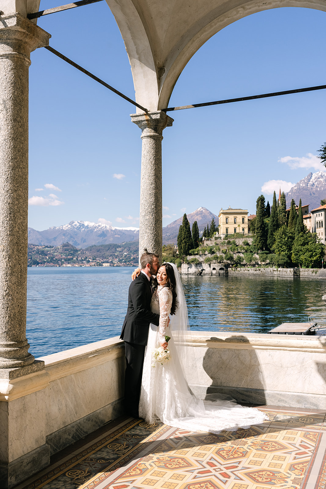 Romantic Lake Como elopement portraits with mountain and lake backdrop