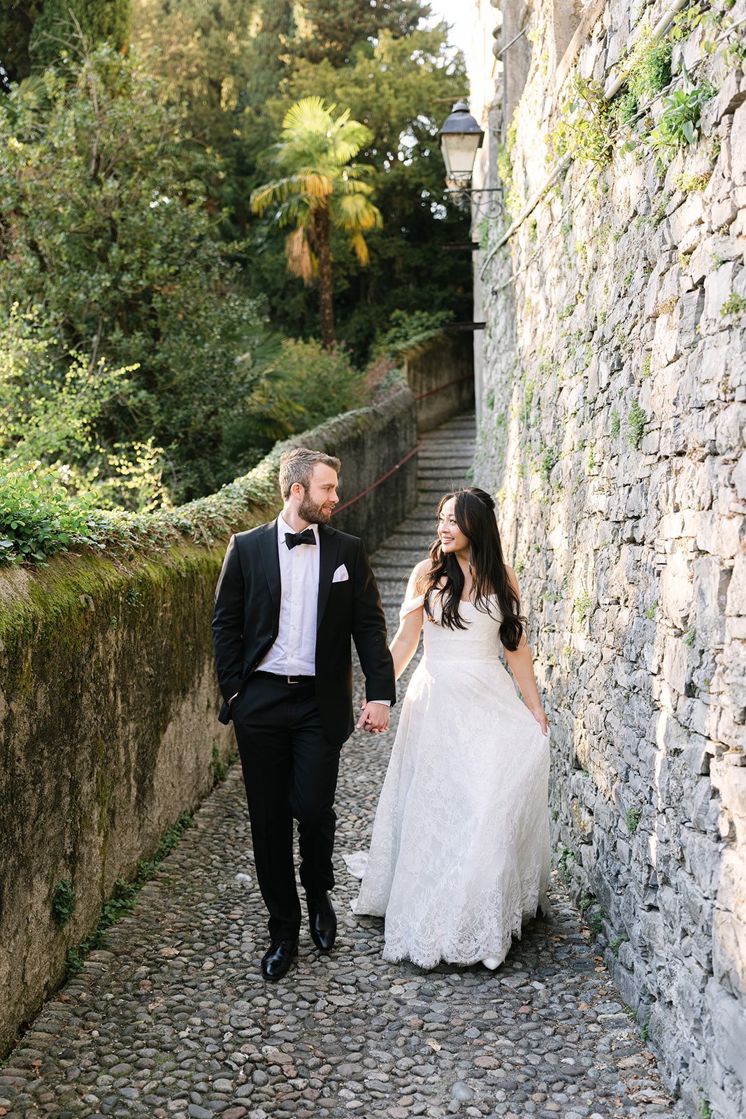 Lake Como elopement couple walking through Italian villa gardens