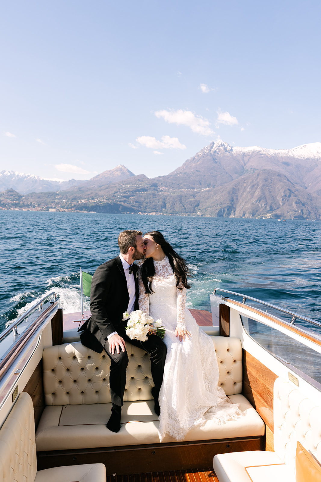 Lake Como elopement bride and groom on private boat with views