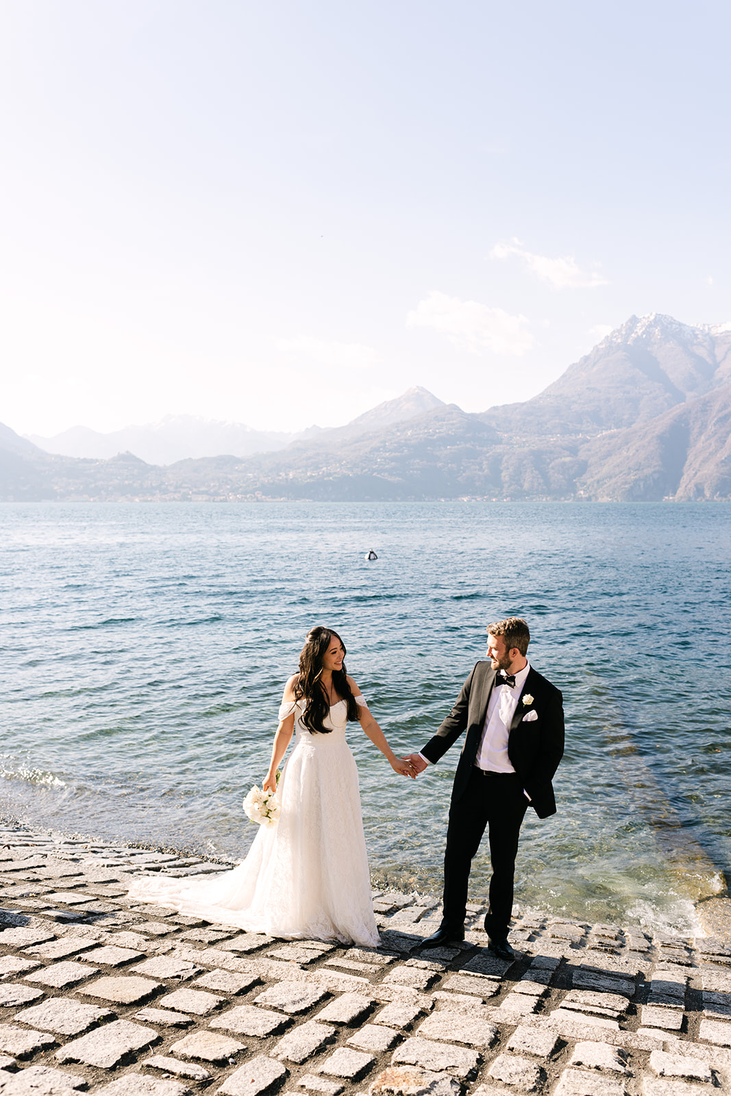 Lake Como elopement couple walking through Villa Monastero by the water